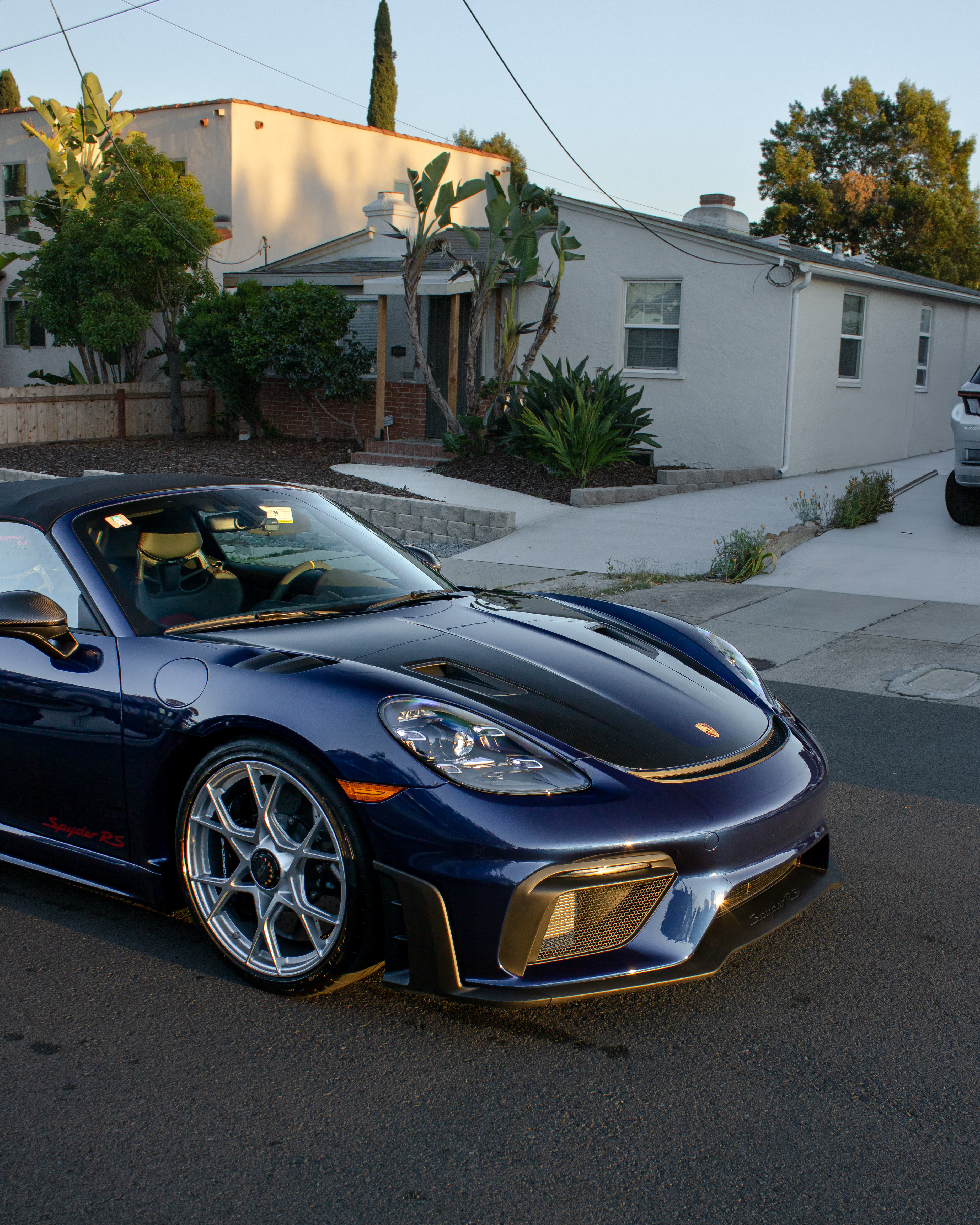 Blue Porsche 718 Spyder RS detailed in a San Diego driveway