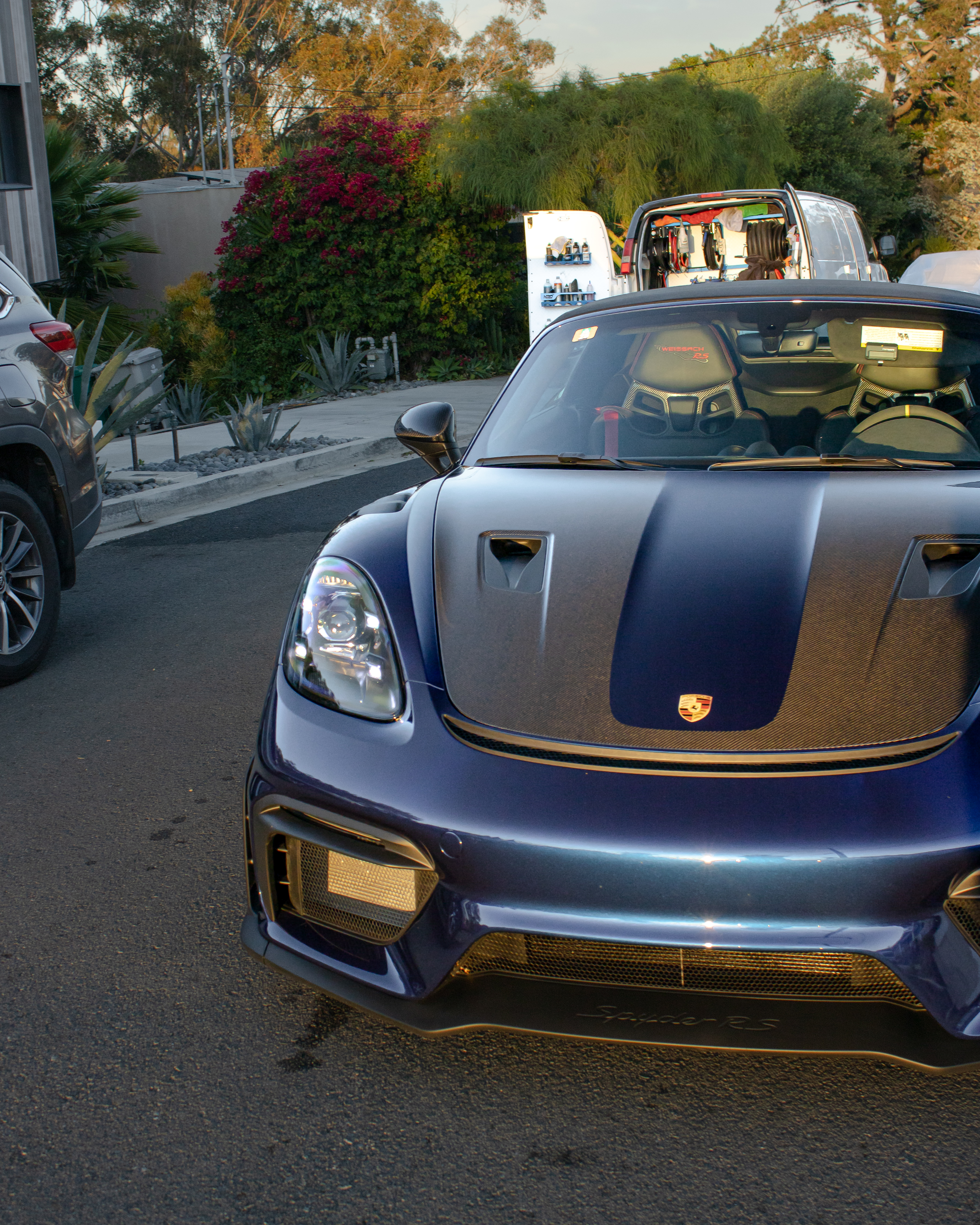 Detailed blue Porsche 718 Spyder RS front end gleaming after a wash and wax