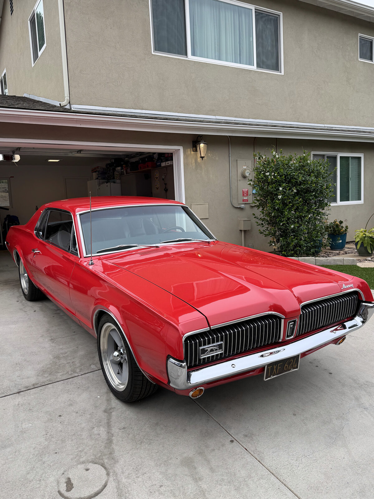 Classic red Mercury Cougar with a glossy finish