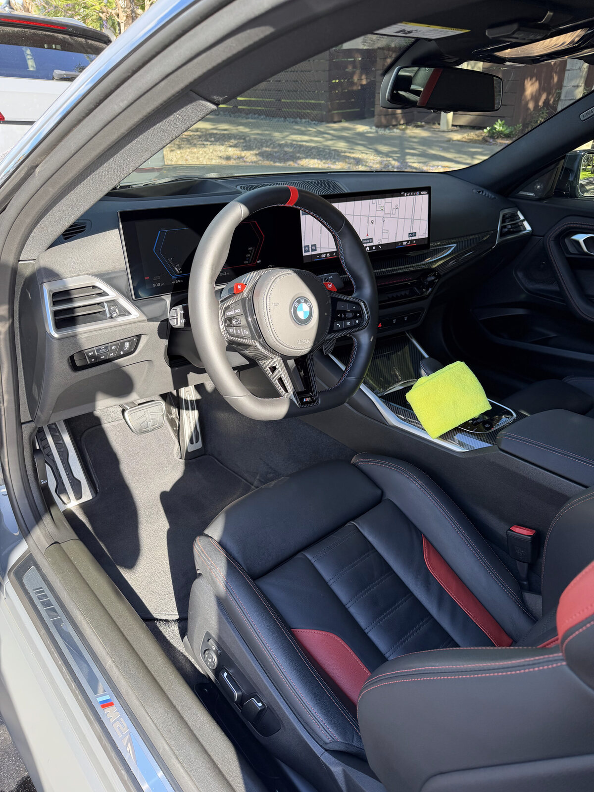 Detailed BMW M2 interior with red and black trim