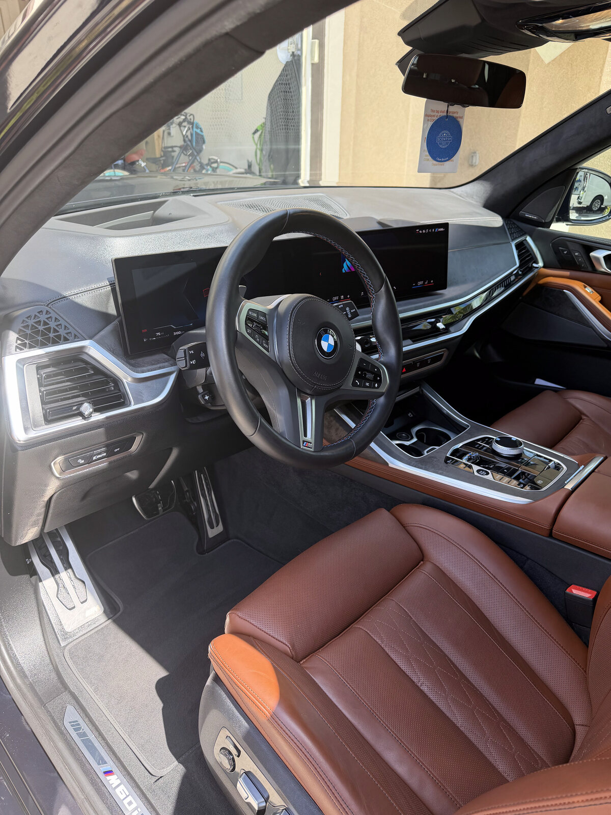 Detailed BMW SUV cockpit with cognac leather